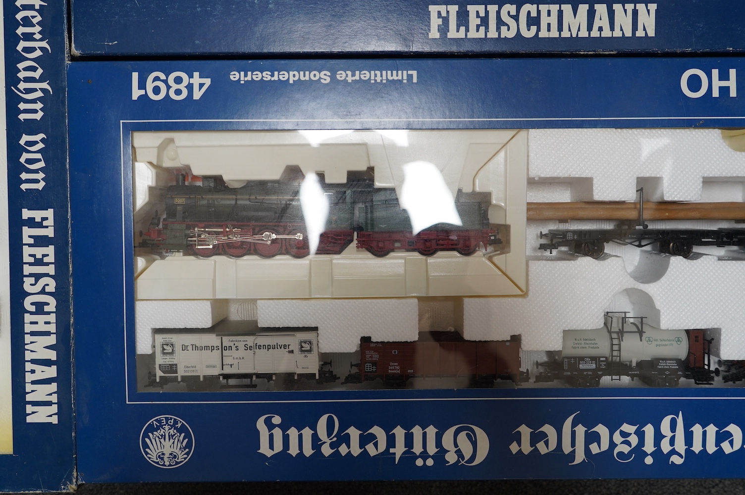 Three boxed Fleischmann HO gauge railway train sets; a passenger set with a 4-6-4T Loco and three clerestory coaches (4887), and two goods train sets, both comprising of a locomotive and an assortment of freight wagons (